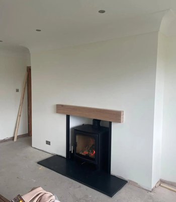 Living room fireplace wall after plastering